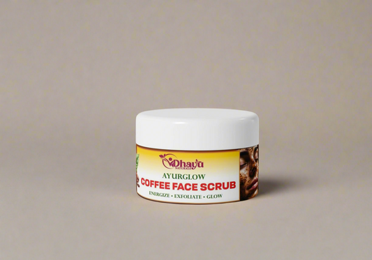 Jar of Dhanya Ayurveda Coffee Face Scrub on a pink background